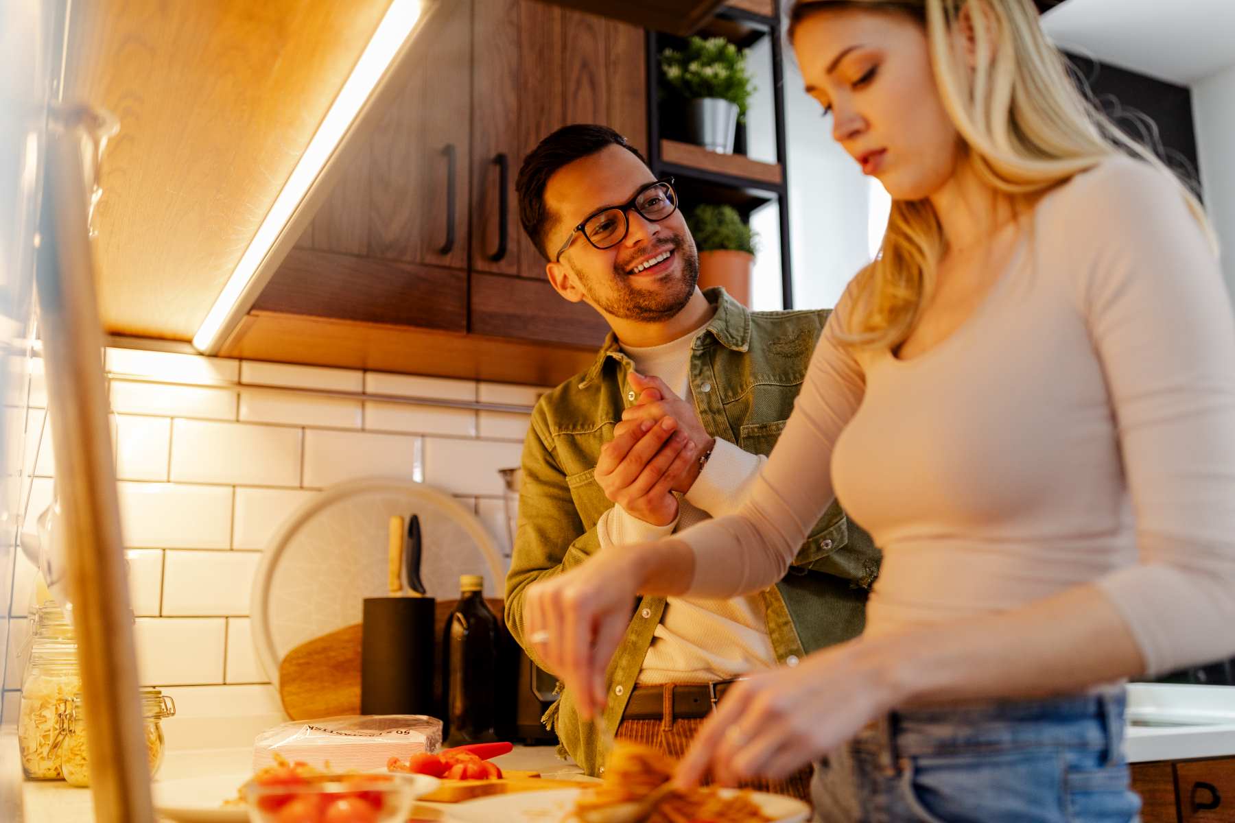 couple cooking tacos